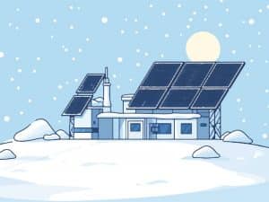 Paneles solares en un tejado nevado durante el invierno